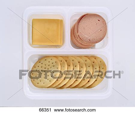 High angle view of crackers and salami with cheese on paper plate View Large Photo Image Stock Image - High angle view of crackers and salami with cheese on paper plate . Fotosearch