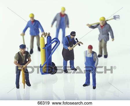 High angle view of figurines of construction workers View Large Photo Image Stock Photo - High angle view of figurines of construction workers . Fotosearch