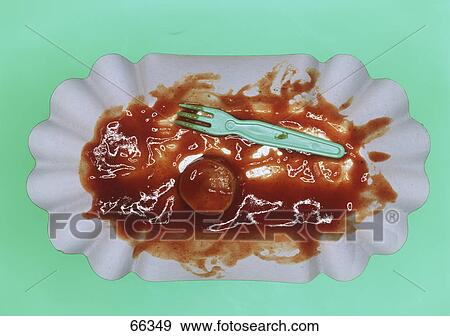 Stock Photo - High angle view of ketchup and fork on paper plate . Fotosearch