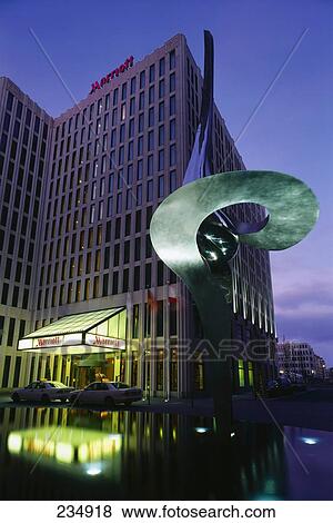 Hotel lit up at dusk, Marriott Hotel, Beisheim Center, Potsdamer Platz, Berlin, Germany View Large Photo Image Stock Photo - Hotel lit up at dusk, Marriott Hotel, Beisheim Center, Potsdamer Platz, Berlin, Germany . Fotosearch