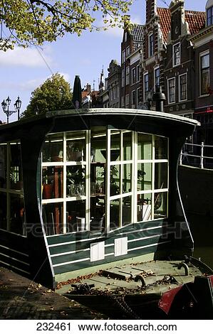 Stock Image - Houseboat in canal, Alkmaar, Netherlands . Fotosearch