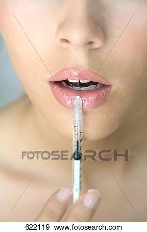 injection into the lips of a woman View Large Photo Image Stock Photo - injection into the lips of a woman . Fotosearch