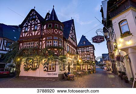Stock Image - Inn Altes Haus on market square in the evening, Bacharach, Germany . Fotosearch