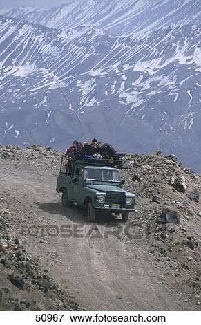 Jeep moving on dirt road, Mt Damavand, Elburz, Iran View Large Photo Image Stock Photo - Jeep moving on dirt road, Mt Damavand, Elburz, Iran . Fotosearch