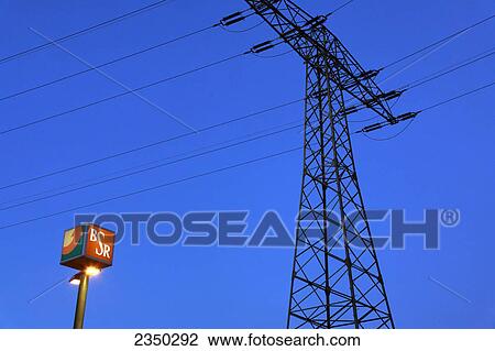 Lamppost in front of electricity pylon, Berlin, Germany View Large Photo Image Stock Image - Lamppost in front of electricity pylon, Berlin, Germany . Fotosearch