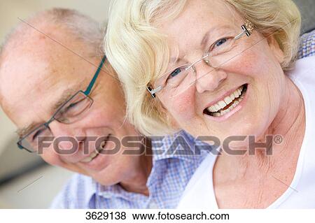 Laughing senior couple outdoors, portrait View Large Photo Image Stock Photo - Laughing senior couple outdoors, portrait . Fotosearch