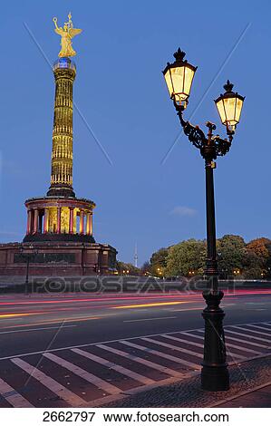 Lit up lamp post in front of monument, Berlin Victory Column, Berlin, Germany View Large Photo Image Stock Photo - Lit up lamp post in front of monument, Berlin Victory Column, Berlin, Germany . Fotosearch