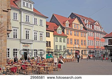 Lively pavement cafe at the Cathedral Square of Erford, Germany View Large Photo Image Stock Image - Lively pavement cafe at the Cathedral Square of Erford, Germany . Fotosearch