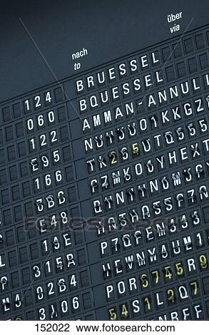 Stock Image - Low angle view of arrival departure board . Fotosearch