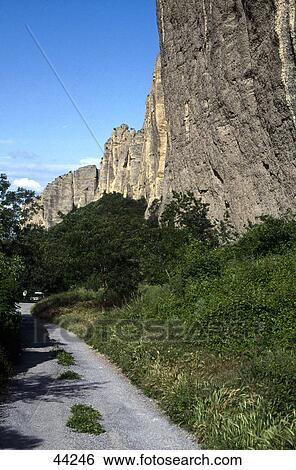 Stock Photograph - Low angle view of rock formations, Les Mees, Alpes-de-Haute-Provence, France . Fotosearch