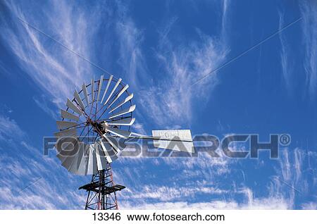 Low angle view of traditional windmill against cloudy sky, Australia View Large Photo Image Stock Photograph - Low angle view of traditional windmill against cloudy sky, Australia . Fotosearch