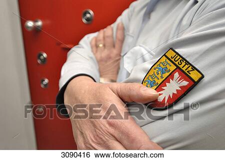 Male officer in front of prison cell View Large Photo Image Stock Photograph - Male officer in front of prison cell . Fotosearch
