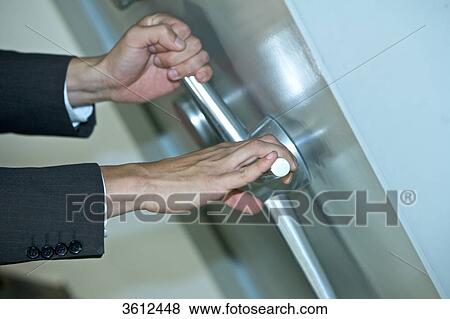 Man opening vault, close-up View Large Photo Image Stock Photo - Man opening vault, close-up . Fotosearch