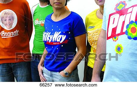 Mid section view of teenage boys and teenage girls advertising on their t-shirts View Large Photo Image Stock Photo - Mid section view of teenage boys and teenage girls advertising on their t-shirts . Fotosearch