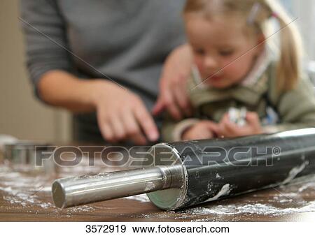 Mother and daughte doing a jigsaw at table View Large Photo Image Stock Photo - Mother and daughte doing a jigsaw at table . Fotosearch