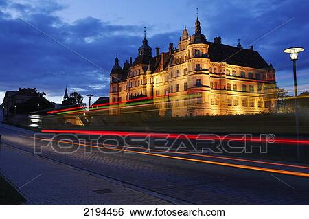 Stock Photograph - Museum lit up at dusk, Mecklenburg-Western Pomerania, Germany . Fotosearch