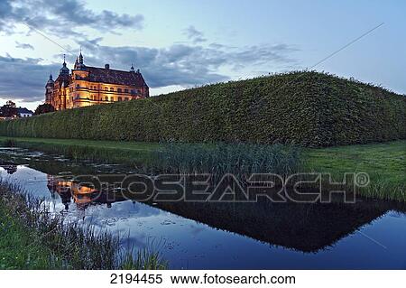 Stock Photography - Museum lit up at dusk, Mecklenburg-Western Pomerania, Germany . Fotosearch