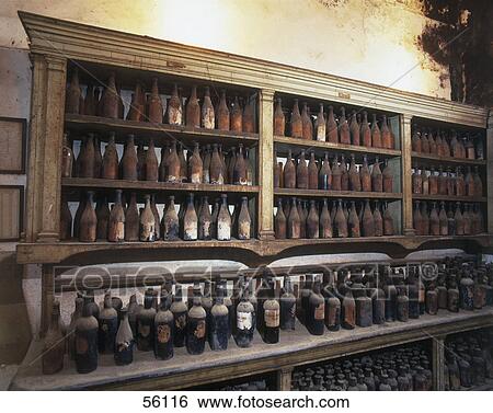 Old bottles in shelves, Andalusia, Spain View Large Photo Image Stock Photograph - Old bottles in shelves, Andalusia, Spain . Fotosearch