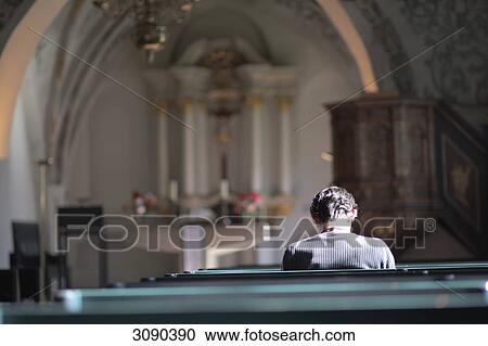 One person sitting in church, Flensburg, Schleswig-Holstein, Germany View Large Photo Image Stock Image - One person sitting in church, Flensburg, Schleswig-Holstein, Germany . Fotosearch
