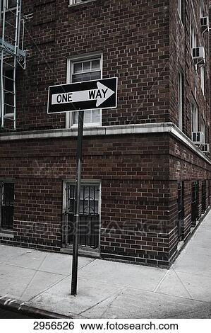 One-way street sign in front of a brick house in Greenwich Village, New York City, USA View Large Photo Image Stock Photograph - One-way street sign in front of a brick house in Greenwich Village, New York City, USA . Fotosearch