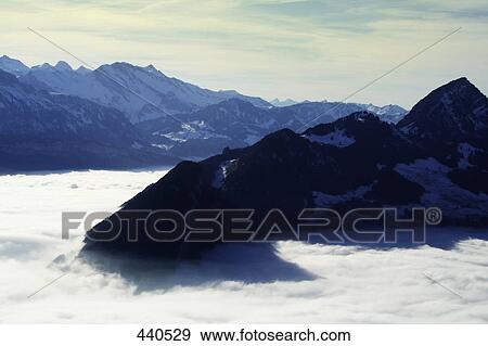 Panoramic view of mountain range, Switzerland View Large Photo Image Stock Photo - Panoramic view of mountain range, Switzerland . Fotosearch