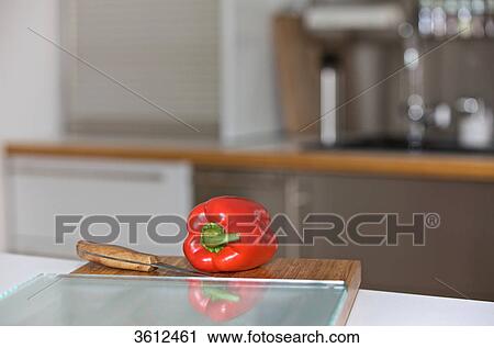 Pepper on chopping board in kitchen View Large Photo Image Stock Image - Pepper on chopping board in kitchen . Fotosearch