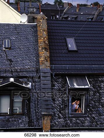 Person behind dormer window View Large Photo Image Stock Photo - Person behind dormer window . Fotosearch