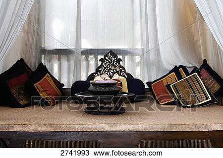 Stock Image - Pillow and cushions on couch in hotel, Thailand . Fotosearch
