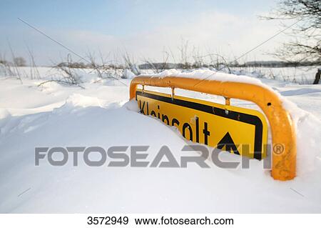 Stock Photo - Place name sign of Kleinsolt in snow, Schleswig-Holstein, Germany, Europe . Fotosearch