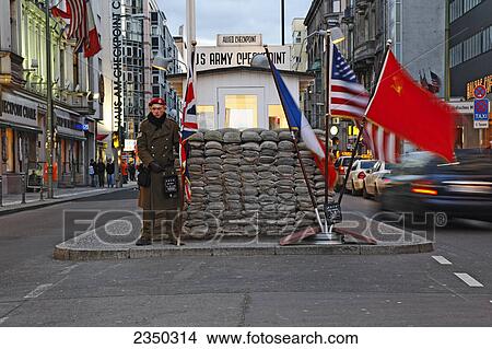 Policeman standing at checkpoint, Checkpoint Charlie, Berlin, Germany View Large Photo Image Picture - Policeman standing at checkpoint, Checkpoint Charlie, Berlin, Germany . Fotosearch