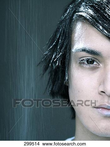 Picture - Portrait of young man looking serious . Fotosearch
