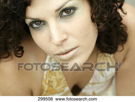 Portrait of young woman looking serious View Large Photo Image Stock Photo - Portrait of young woman looking serious . Fotosearch