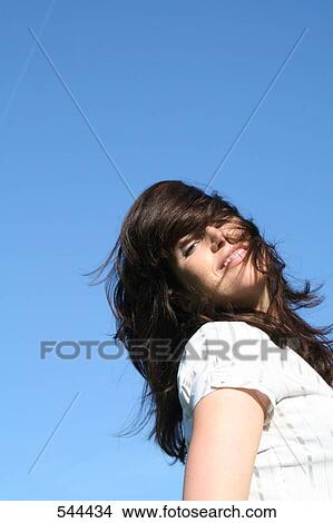 Portrait of young woman smiling View Large Photo Image Picture - Portrait of young woman smiling . Fotosearch