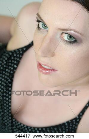 Stock Photo - Portrait of young woman smiling . Fotosearch