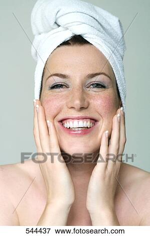 Stock Photo - Portrait of young woman smiling . Fotosearch