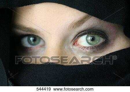 Portrait of young woman wearing a burqa View Large Photo Image Stock Photo - Portrait of young woman wearing a burqa . Fotosearch