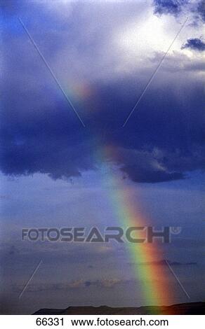 Rainbow against cloudy sky, Capetown, South Africa View Large Photo Image Stock Image - Rainbow against cloudy sky, Capetown, South Africa . Fotosearch
