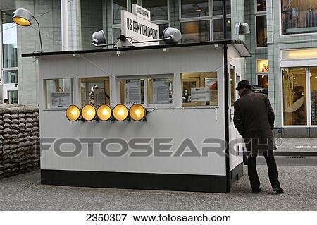 Rear view of man standing at checkpoint, Checkpoint Charlie, Berlin, Germany View Large Photo Image Stock Photo - Rear view of man standing at checkpoint, Checkpoint Charlie, Berlin, Germany . Fotosearch