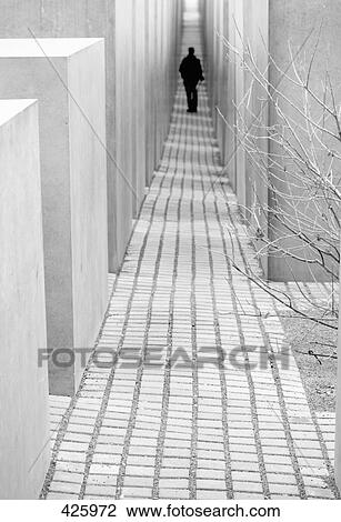 Rear view of tourist standing in memorial, Holocaust Memorial, Berlin, Germany View Large Photo Image Stock Image - Rear view of tourist standing in memorial, Holocaust Memorial, Berlin, Germany . Fotosearch