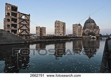 Stock Image - Reflection of buildings in water, Spree River, Palast Der Republik, Berlin, Germany . Fotosearch