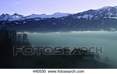 Reflection of mountains in water, Switzerland View Large Photo Image Stock Image - Reflection of mountains in water, Switzerland . Fotosearch
