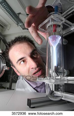 Stock Photograph - Scientist experimenting with plasma, Uni Kiel, Schleswig-Holstein, Germany, Europe . Fotosearch
