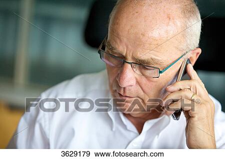 Senior man on cell phone View Large Photo Image Stock Photo - Senior man on cell phone . Fotosearch