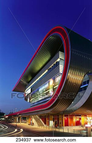 Shopping mall lit up at dusk, Eastgate Station, Marzahn-Hellersdorf, Berlin, Germany View Large Photo Image Stock Photo - Shopping mall lit up at dusk, Eastgate Station, Marzahn-Hellersdorf, Berlin, Germany . Fotosearch