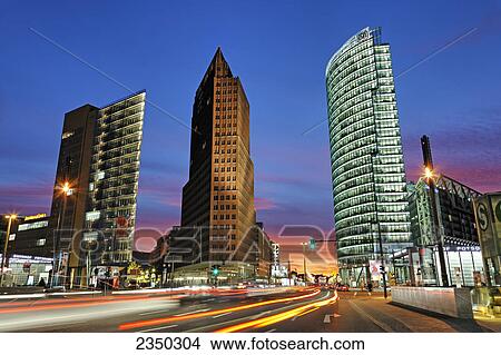 Skyscrapers lit up at dusk, BahnTower, Kollhoff Tower, Potsdamer Platz, Berlin, Germany View Large Photo Image Picture - Skyscrapers lit up at dusk, BahnTower, Kollhoff Tower, Potsdamer Platz, Berlin, Germany . Fotosearch