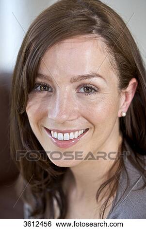 Smiling brunette woman, portrait View Large Photo Image Stock Photograph - Smiling brunette woman, portrait . Fotosearch