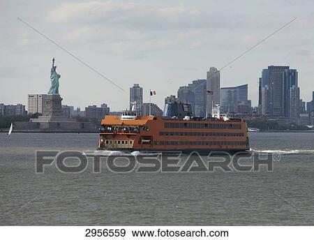 Staten Island Ferry in front of the Statue of Liberty, New York City, USA View Large Photo Image Stock Photo - Staten Island Ferry in front of the Statue of Liberty, New York City, USA . Fotosearch