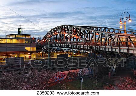 Stock Image - Steel bridge across railway tracks, Bornholmer Brucke, Berlin, Germany . Fotosearch