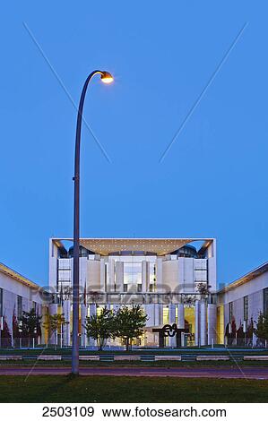 Stock Photo - Street light lit up in front of government building, German Chancellery, Berlin, Germany . Fotosearch