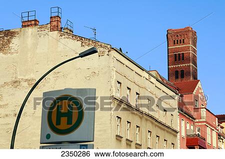Street light near bus stop sign, Berlin, Germany View Large Photo Image Stock Photograph - Street light near bus stop sign, Berlin, Germany . Fotosearch